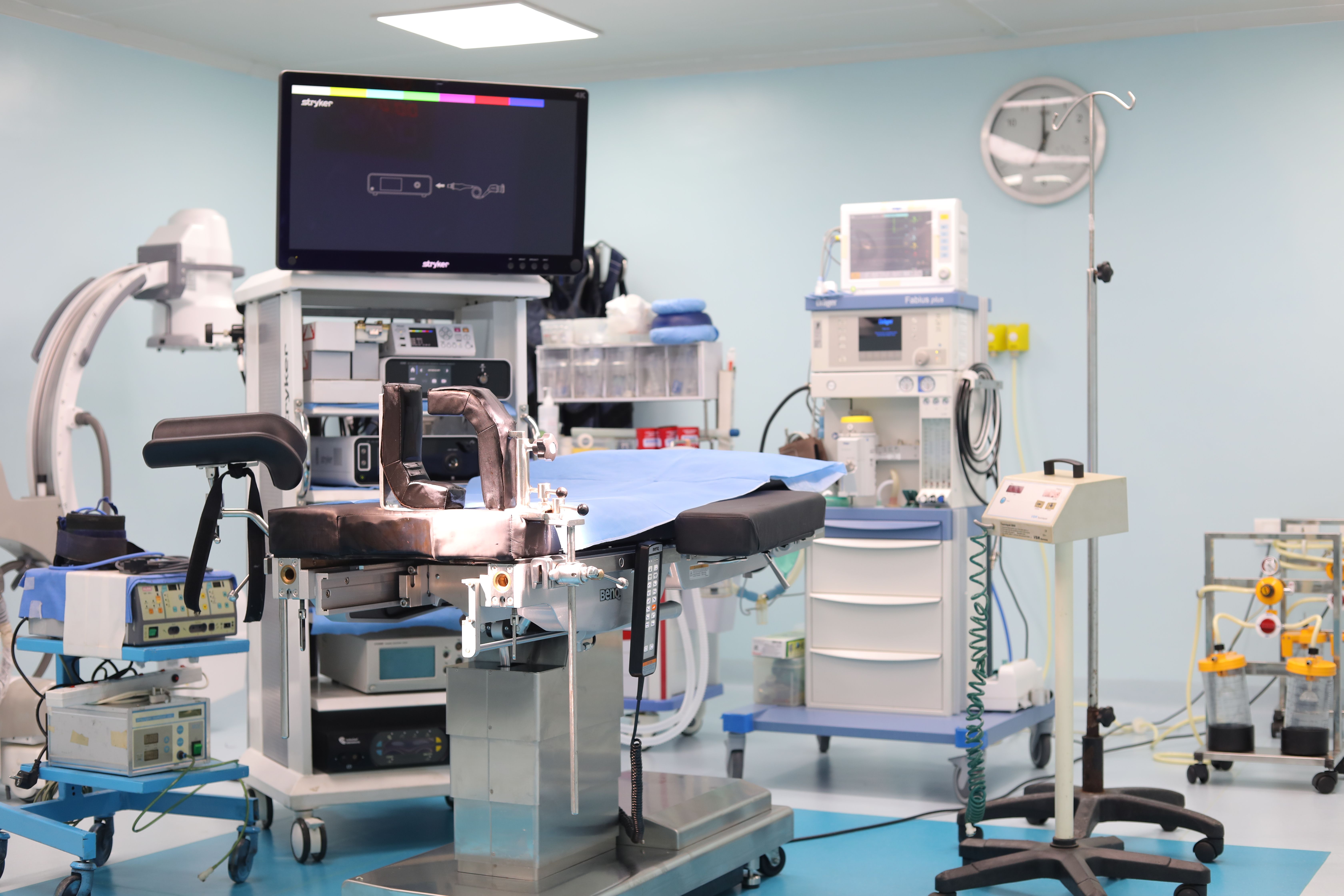 Surgical team using C-arm fluoroscopy in the operating room